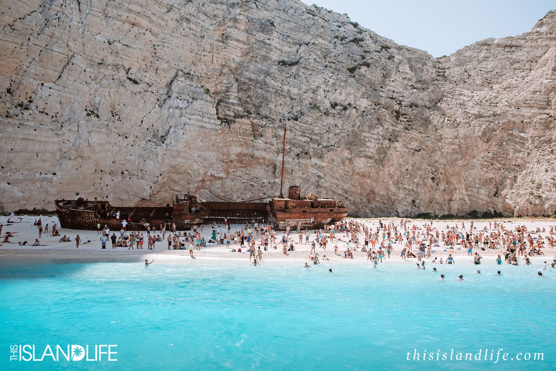 Tourists on Navagio (Shipwreck) Beach on Zakynthos