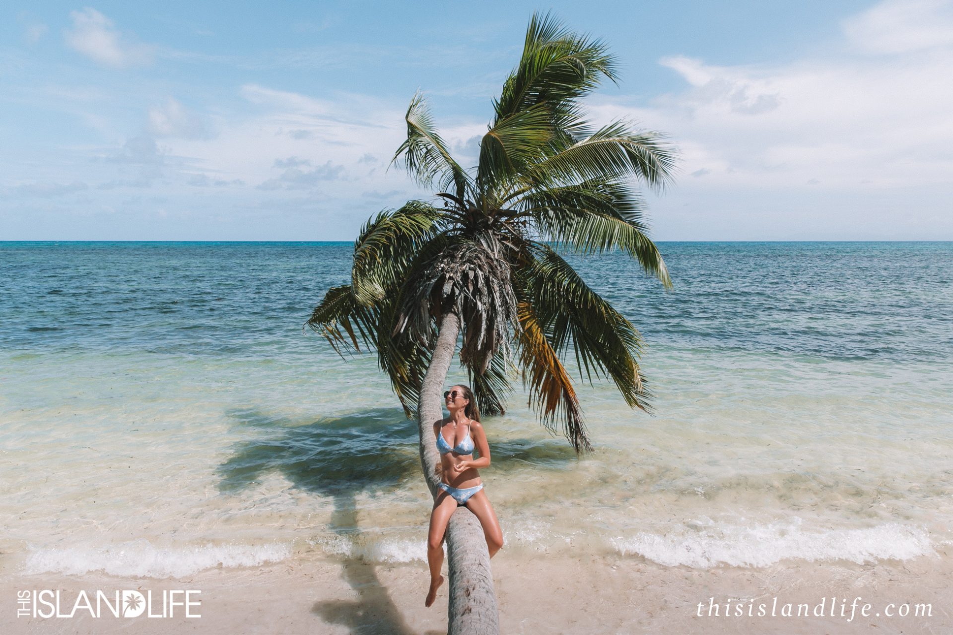 Laura McWhinnie from This Island Life exploring the palm-fringed beaches of Praslin Island in the Seychelles.