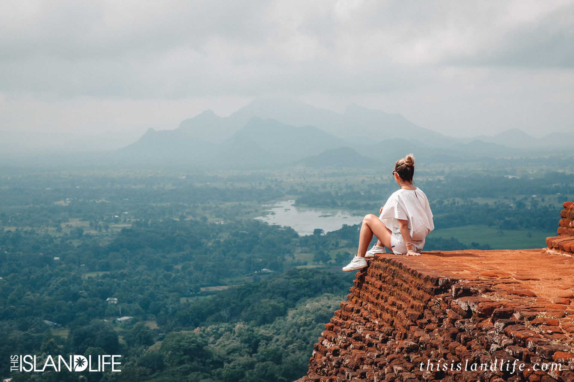 Woman on top of Sigiriya rock in Sri Lanka