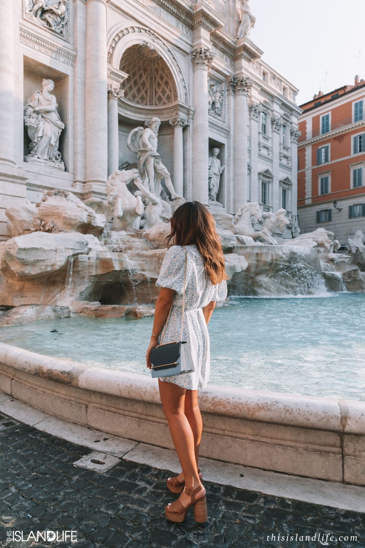 Girl sightseeing at Trevi Fountain in Rome