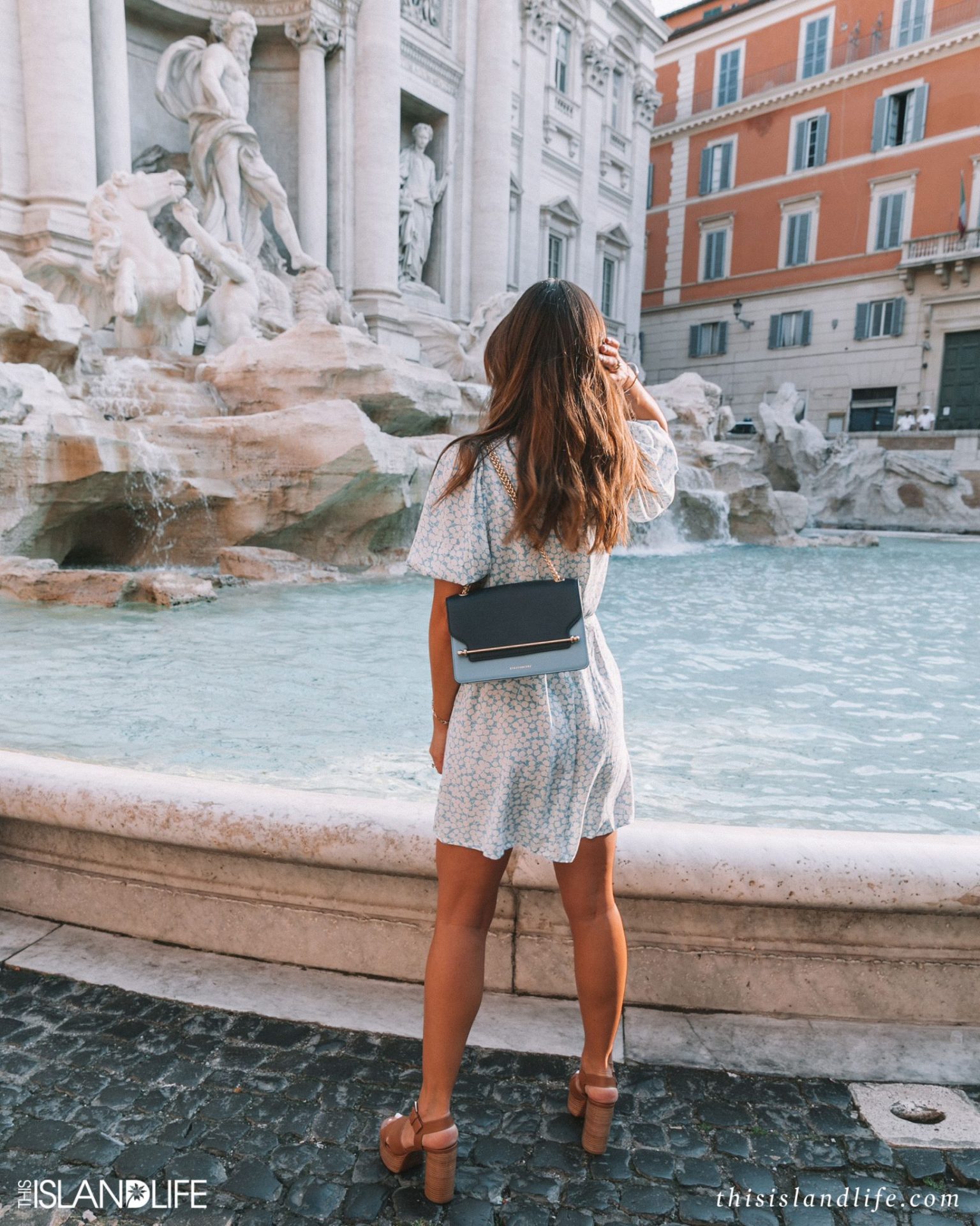 Girl sightseeing at Trevi Fountain in Rome